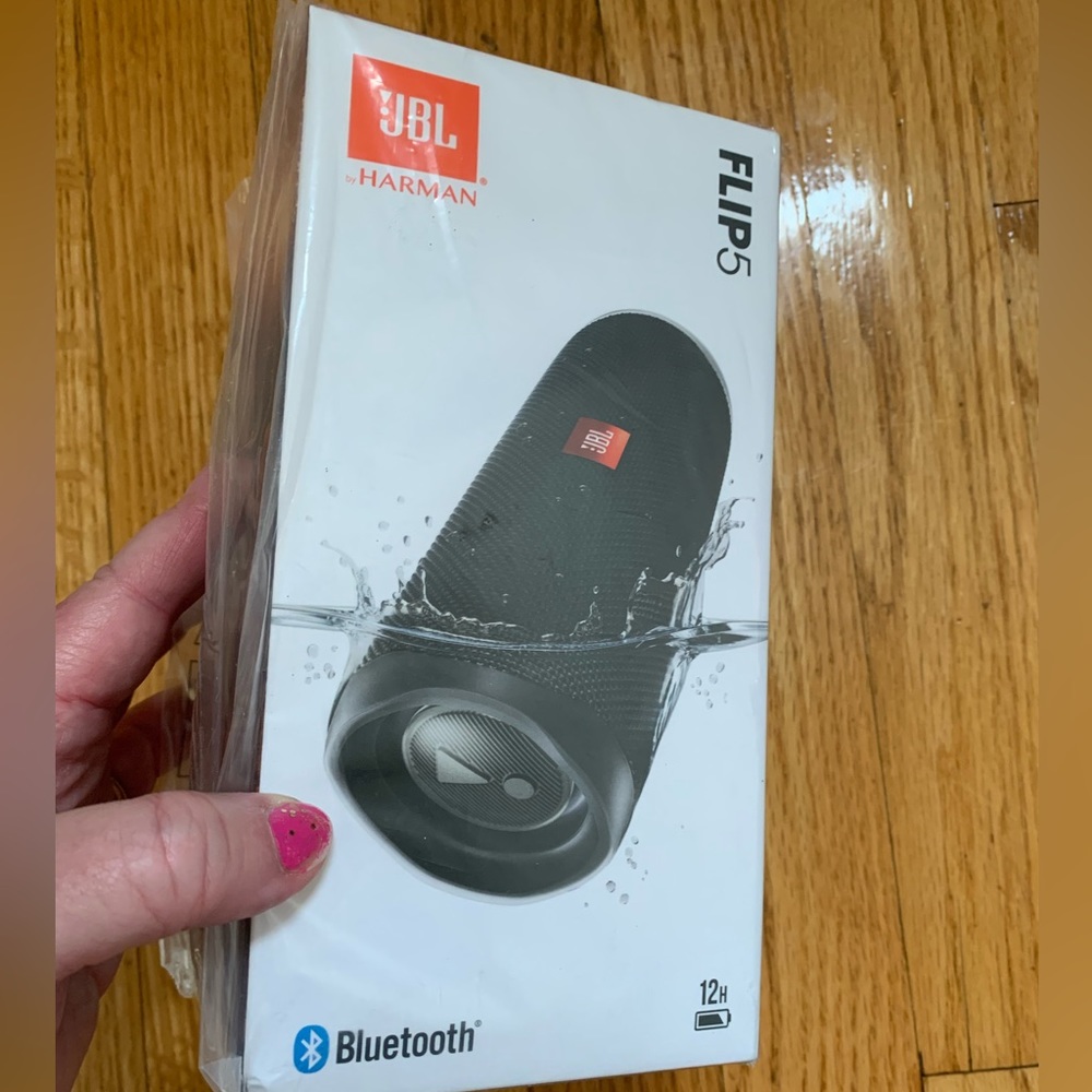 Brand New. In package. JBL. 12H. Harmon Flip 5 speaker w/Bluetooth capability.